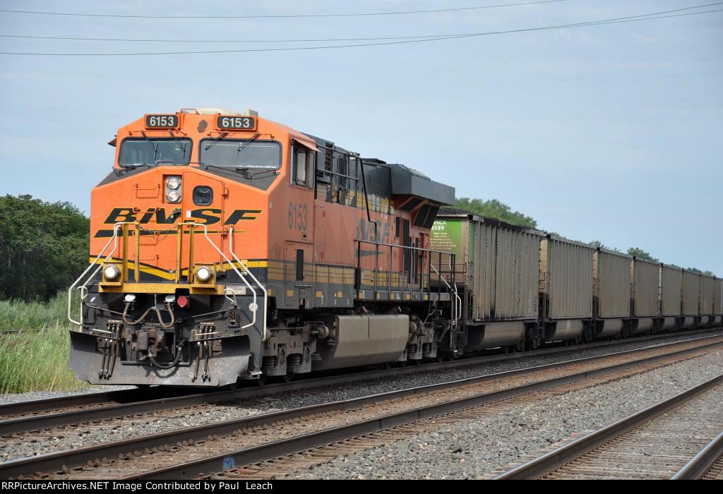 Loaded coal train rolls east